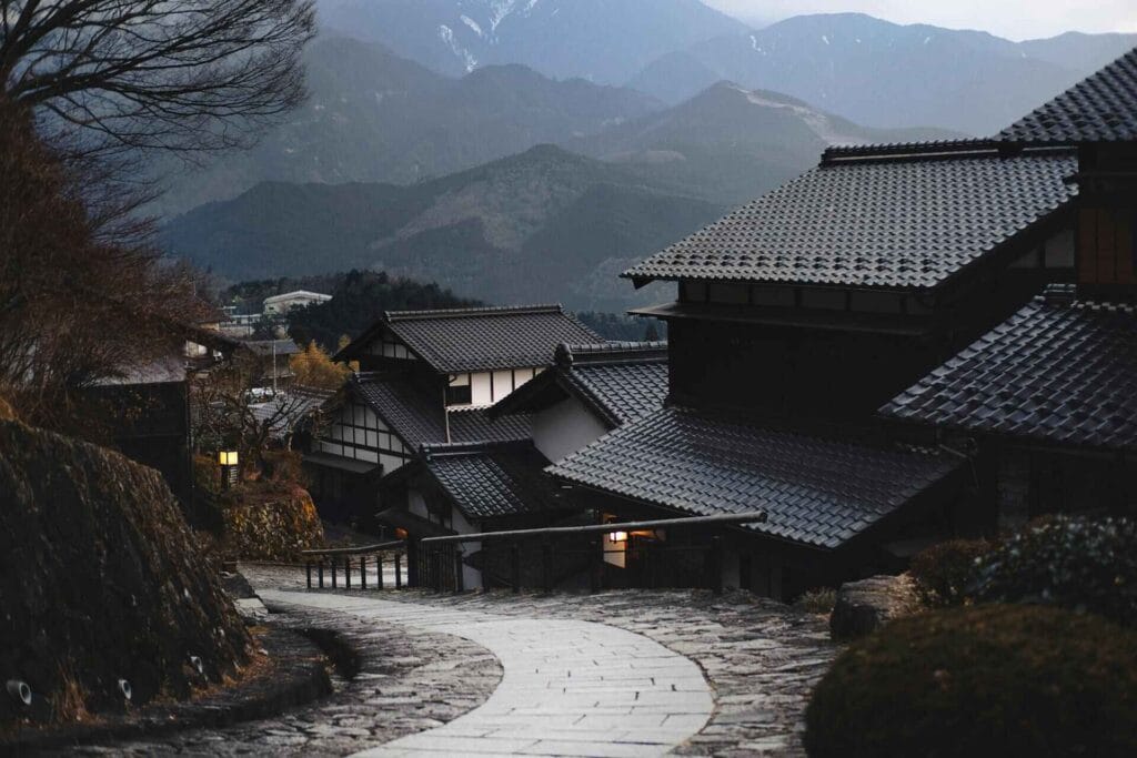 Scenic view of beautiful traditional Japanese houses nestled in a peaceful hilly area.