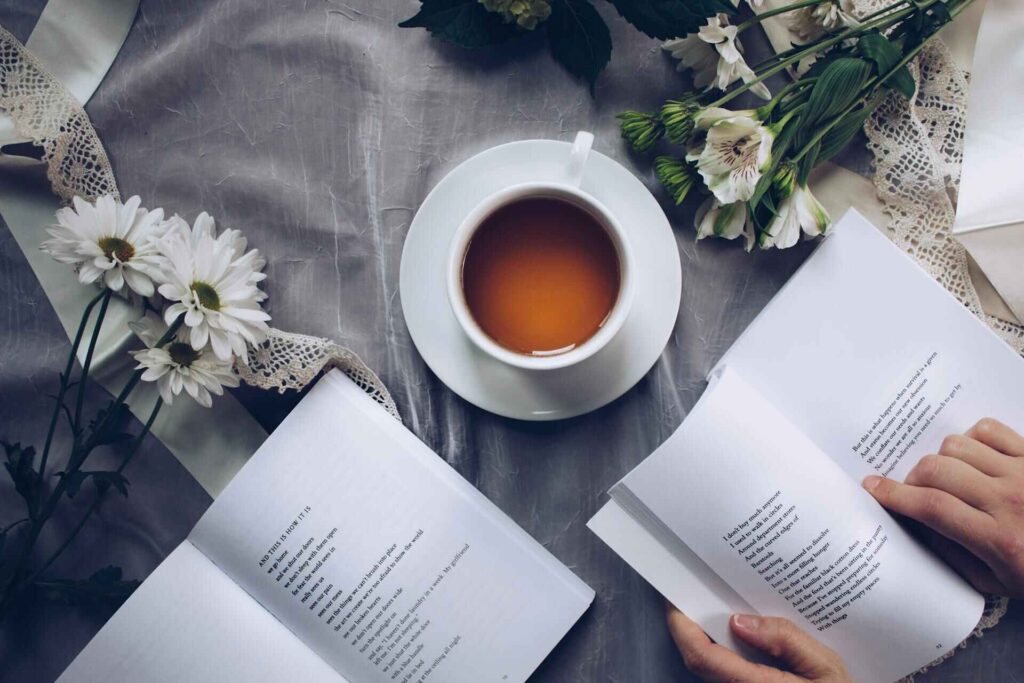 Stoic philosophy books on a table with coffee — setting the tone for mindful self-reflection.